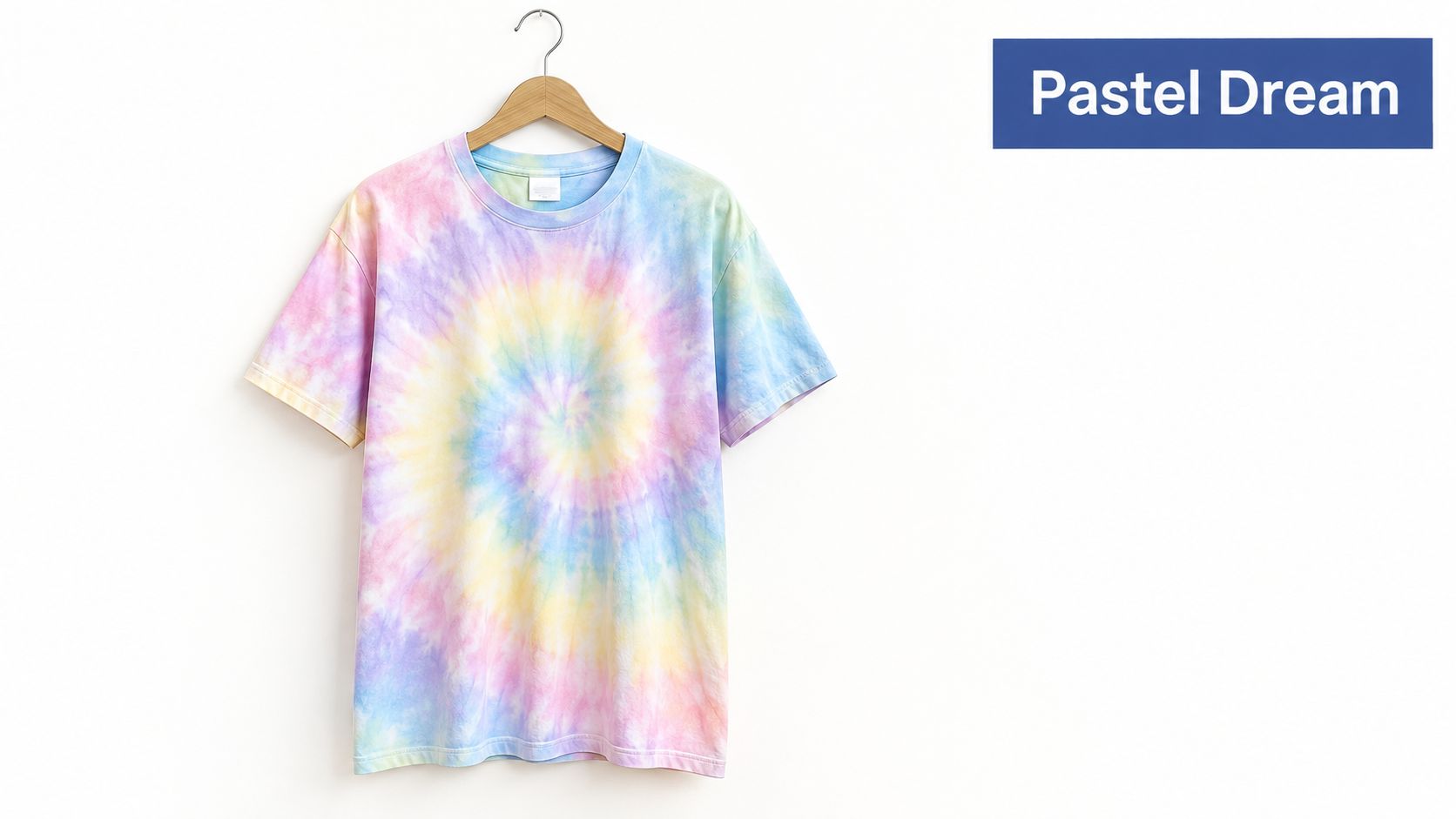A tie-dye t-shirt with soft pastel colors hanging on a wooden hanger against a white background.