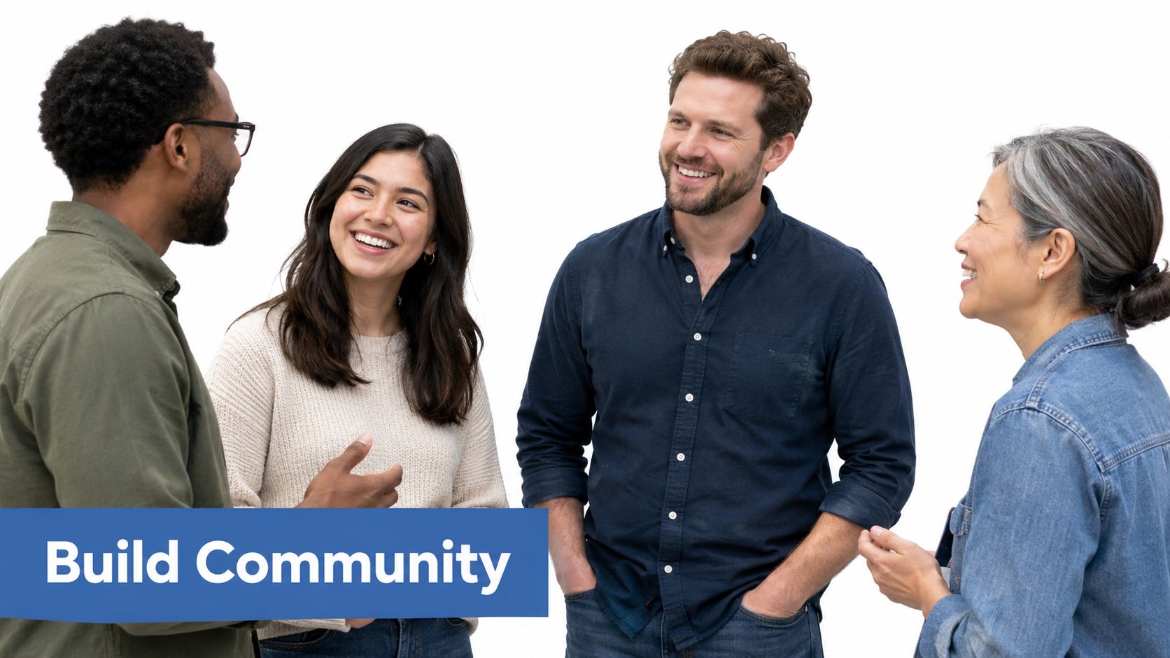 A diverse group of four smiling professionals standing together engaged in a friendly and productive workplace conversation.